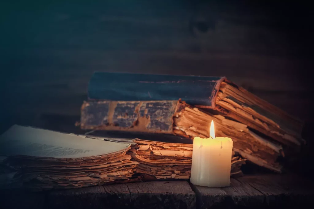 Old books and candle.